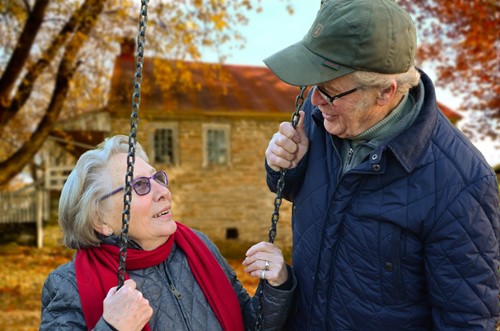 Older man and women spending time outside in colder weather.